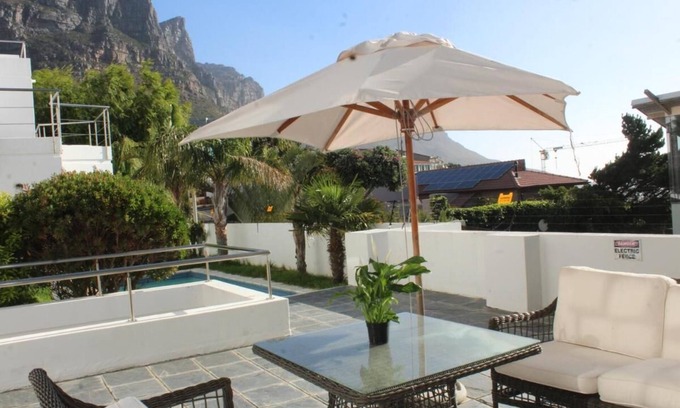 Camps Bay Ski Chalet | Cozy Camps Bay House with mountain and sea view