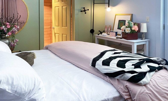 Lenox Bed & Breakfast | Cozy Carriage House room with a double bed and private balcony