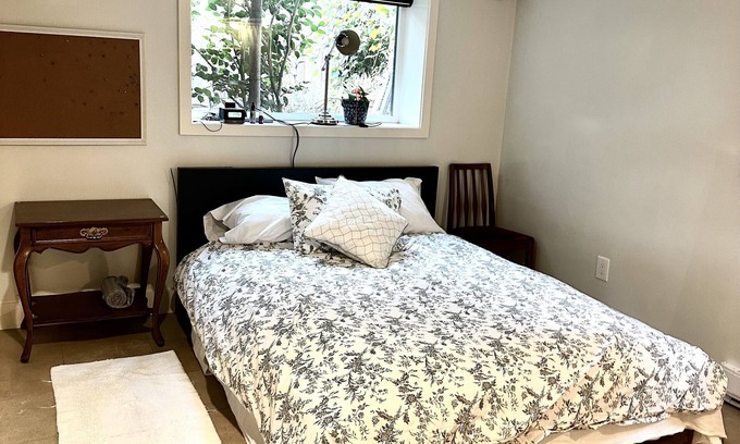 Grandview-Woodland House | Cozy Garden level suite with heated floors. 1 block off “The Drive”.