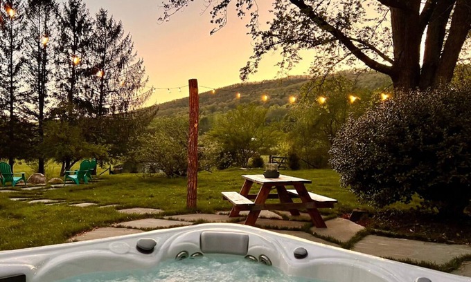 Mills River Cottage | Cozy home w/hot tub & huge fenced yard & firepit!