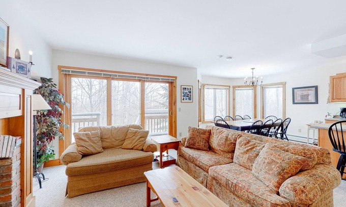 North Troy Condo | Cozy ski-in/ski-out home next to Grammy Jay trail with fireplace, mountain views