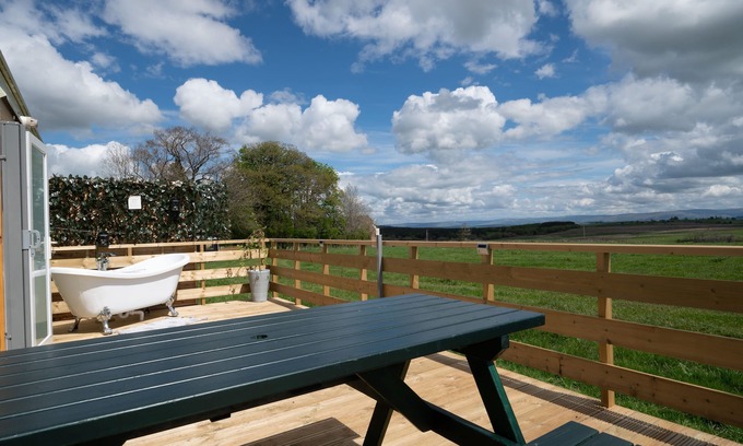 Penrith Cabin | Cross Fell - Stunning views and an outdoor bath tub on the decking!