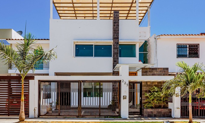 Fluvial Vallarta House | Dazzling estate with a pool, rooftop balcony, four-bedrooms, washer/dryer, & AC