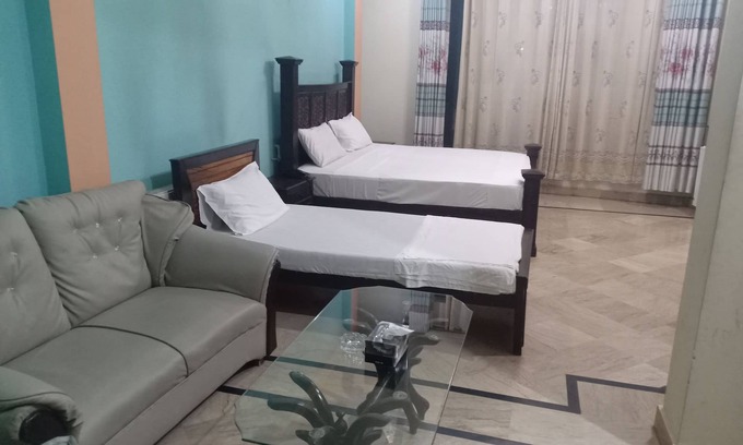 G-8 Sector House | Deluxe room with extra single bed