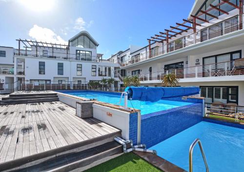 Big Bay Apartment | Designer Beachfront Apartment in Big Bay with swimming pool- 2 bedroom, 1 Azure