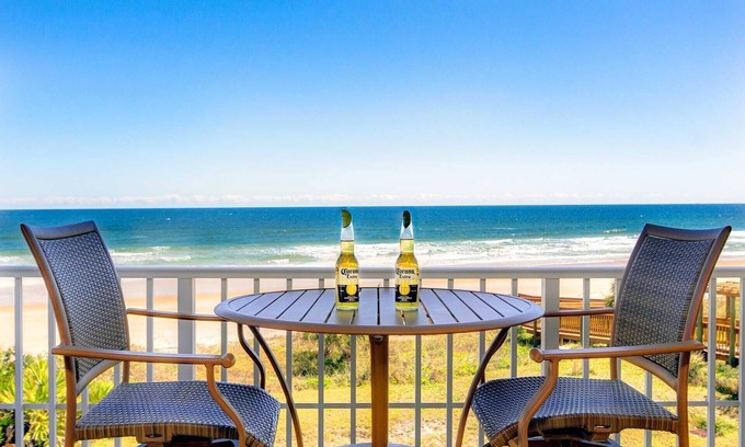 Seawinds Condo Condo | Direct oceanfront corner condo with large balcony, beachfront pool, and garage parking