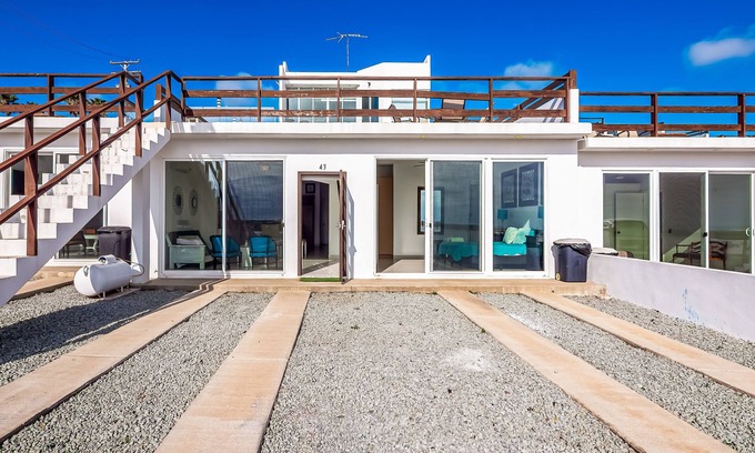 La Paloma House | Dog-friendly beachfront villa with pool & hot tub access plus rooftop deck