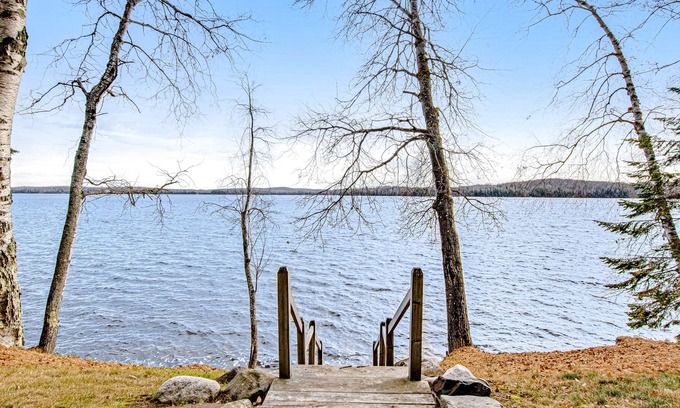 Presque Isle Cabin | Dog-friendly cabin with waterfront views, lake access, sandy beach, & rec room