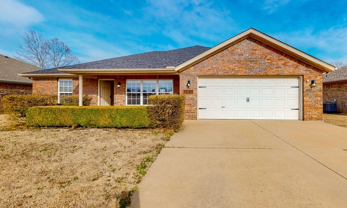 Bentonville House | Dog-friendly charmer with an enclosed yard, fireplace, jetted tub, W/D, and AC