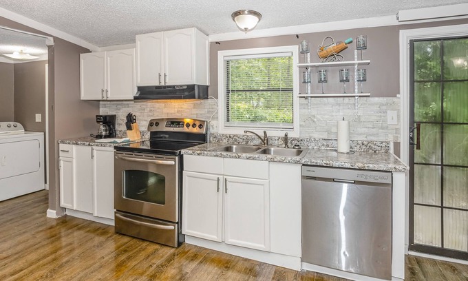 Shallotte House | Dog-friendly home in a prime location with a yard, patio, washer/dryer, and AC