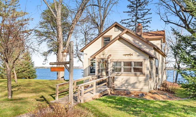 Presque Isle House | Dog-friendly lakefront home with fireplace, porch, water access, & rec room