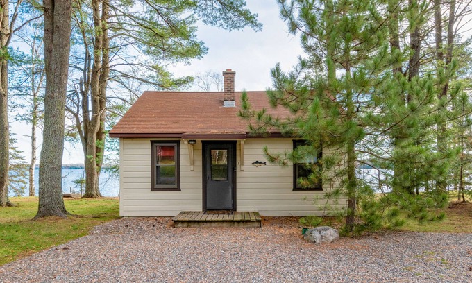 Presque Isle Cabin | Dog-friendly lakefront cabin with on-site swimming, fishing, & rec room