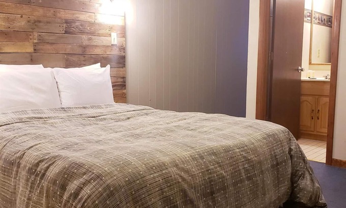 Ironwood Apartment | Dog Friendly, Private Guestroom with TWO QUEEN beds and two small bathrooms inside the Lodge at North Ironwood Acres resort.
