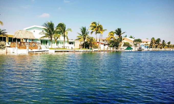 Key Colony Beach House | Dog-Friendly Waterfront House with 37ft Dock and Cabana Beach Club & Pool