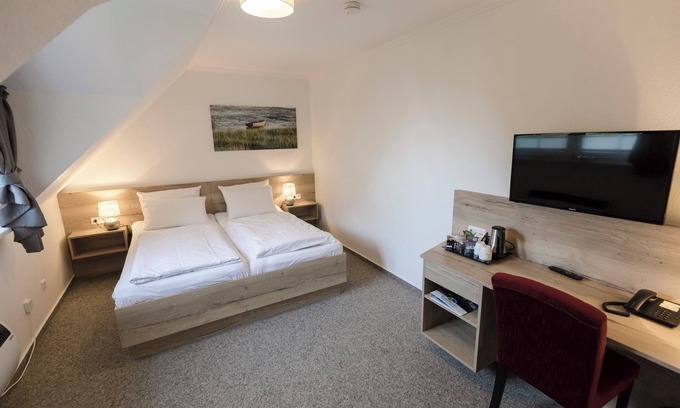 Dorumer Neufeld Apartment | Double room 118. Cozy and for two.