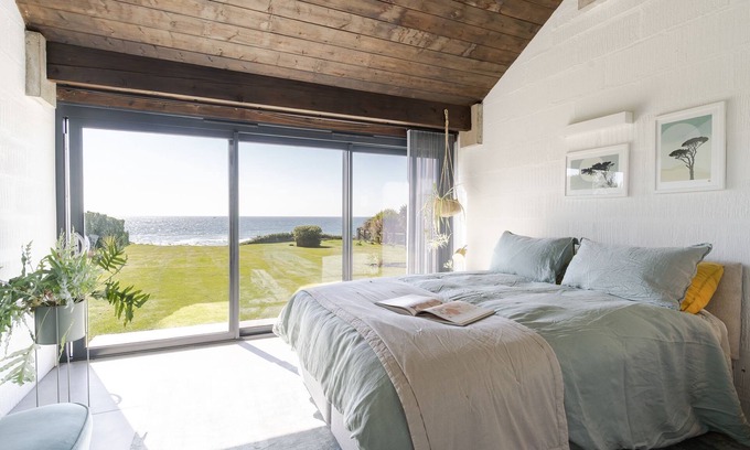 Downderry House | Downderlin is a light-filled beautiful home with a large garden that rolls directly onto the beach.