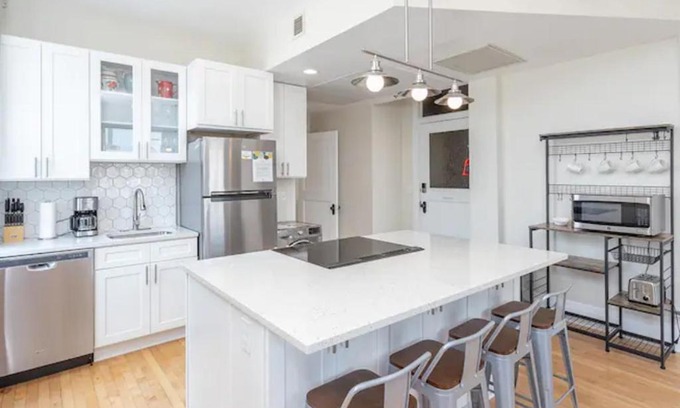 Boise Apartment | Downtown Digs-View of the City! Stay above local restaurants and nightlife, posh amenities heated toilet seat, oversized rain shower head in glass shower, in-unit laundry, one garage parking spot