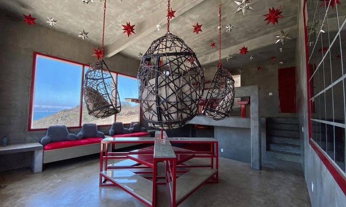 Ensenada Apartment | Eclectic Cliffside Den with Hanging Living Area