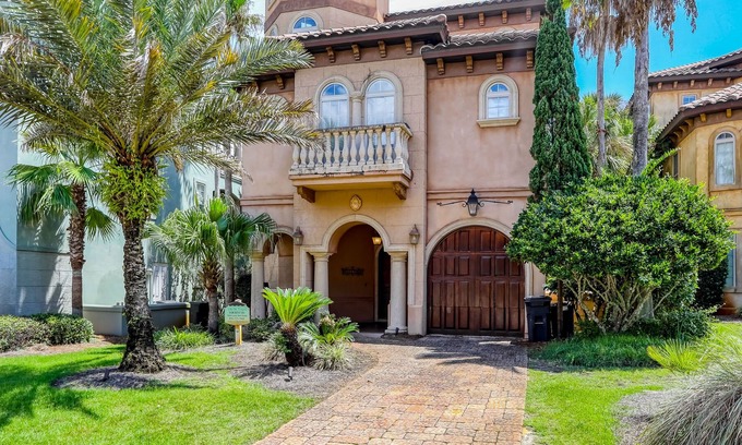 St. Tropez House | Elegant coastal villa with spacious patio, pool, hot tub, free WiFi & central AC