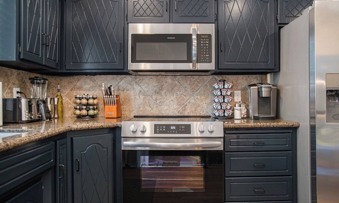 West Omaha House | Elegant Golden Getaway, w/Hot Tub & Fenced Yard!