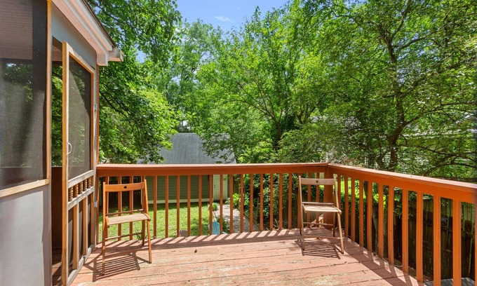 East Side House | Embark on a Grant Park Retreat: Zoo Proximity, Fire Pit Relaxation, and Lion-Sized Dinner Ambience