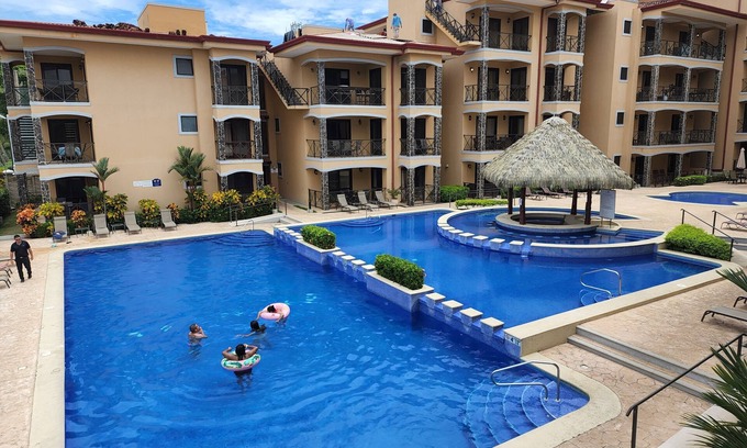 Barrio Los Villalobos Condo | Enjoy the beach view while sitting on the lanai