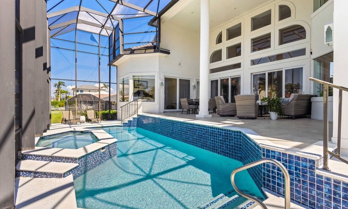 Vanderbilt Beach House | Exquisite waterfront home with lanai, heated pool and spa(hot tub), and internet