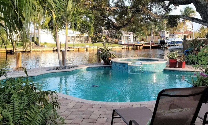 Garden Isles House | Family Waterfront Retreat – Private Pool, Hot Tub, Walk to Beach!