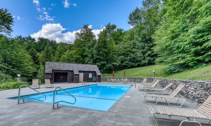 Waitsfield Condo | Fantastic wooded escape with shared pool and sports courts, fast WiFi & deck