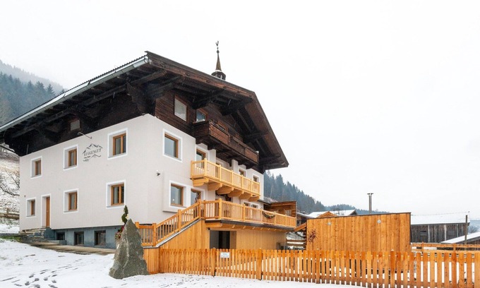 Bramberg am Wildkogel House | Farmhouse in Bramberg with Natural Pond