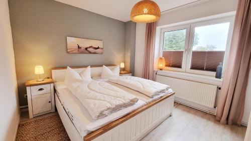 Kalifornien Apartment | Ferienwohnung "Achtern Diek 1" 1 Reihe an der Ostseeküste