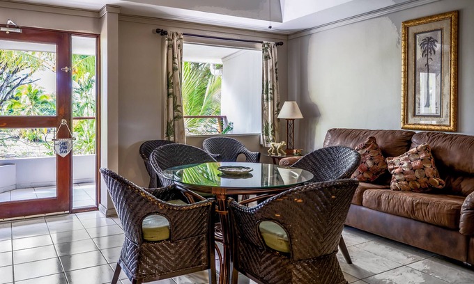 Damas Condo | Fun & bright getaway with furnished balcony, pool, volleyball & tennis courts