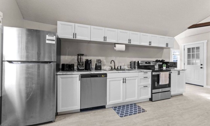 West Central Apartment | Gorg Wooden Beams w/Brick Accents in Downtown Apt
