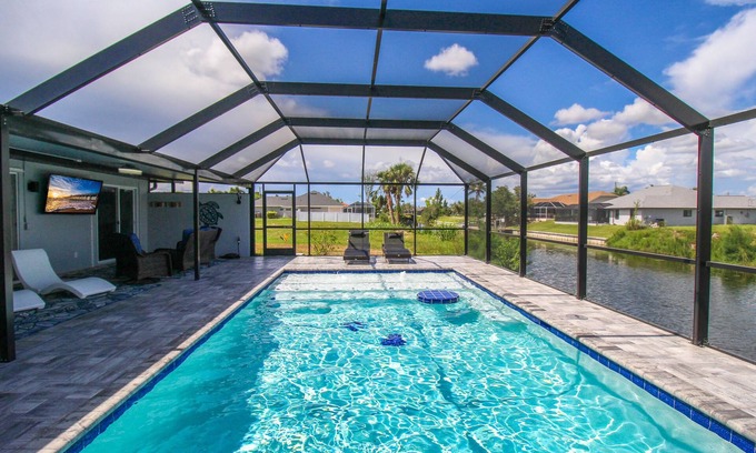 Trafalgar House | Gorgeous canal front pool home in Cape Coral