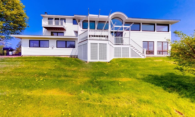 Charlotte House | Gorgeous home with amazing lake views, fireplace, firepit, hot tub, & balcony