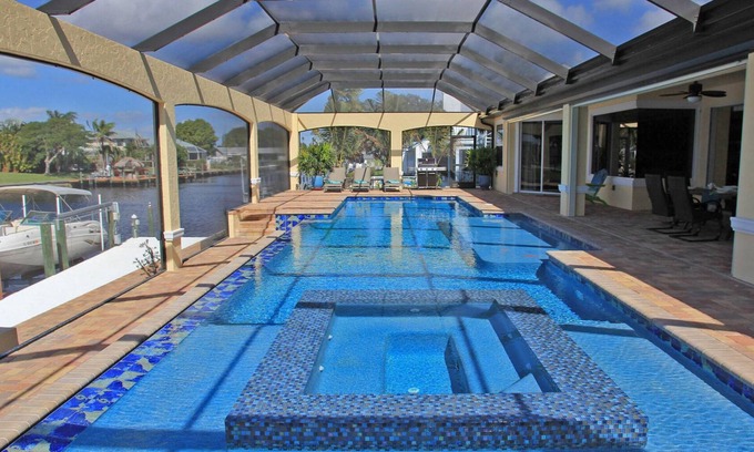 Caloosahatchee House | Gorgeous Retreat 54 ft Pool & Spa 5-Zone AC 2 Min to River 5 Min to Ft Myers