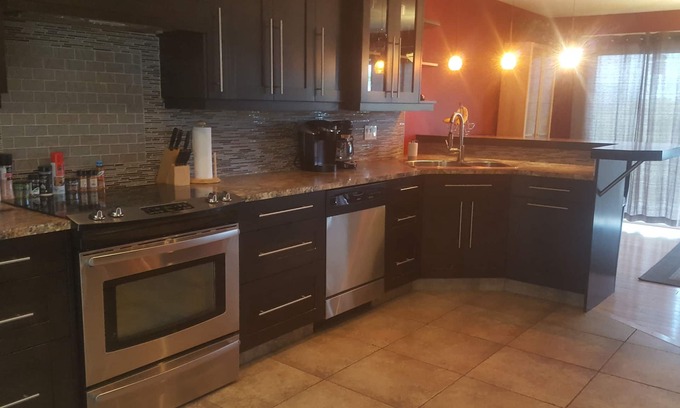 Vernon House | Gourmet kitchen, luxurious bath A/C, gas fireplace, BBQ & private backyard patio