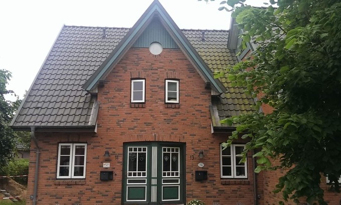 Wyk auf Foehr Apartment | Green Eilun 13 - Modernes Reihenhaus mit Garten, Spielecke, Waldzugang und Nähe zum Südstrand