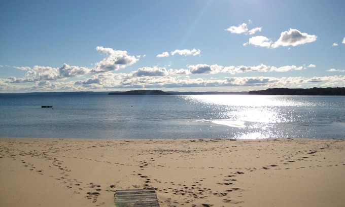 Traverse City House | Guest House on Old Mission, Pure Sand Beach, Sunset, Wineries, A Couple Respite.