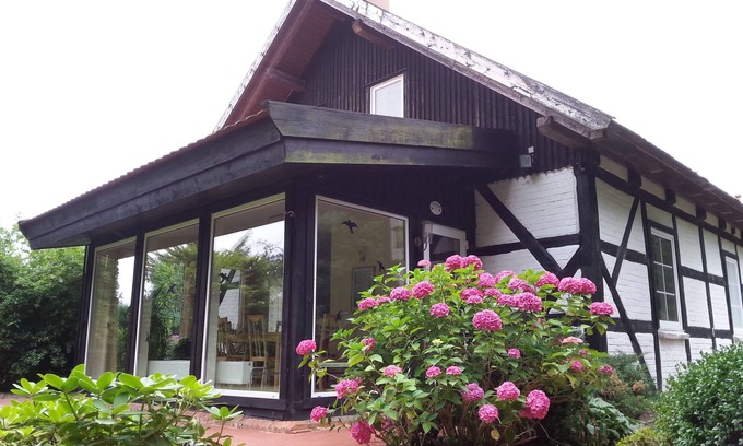 Muritz House | Half of the house with a large garden, pool, campfire and smoker