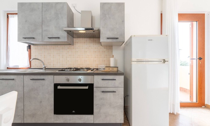 Masainas Apartment | Holiday Apartment "Is Lais 2" with Sea View, Shared Garden & Wi-Fi