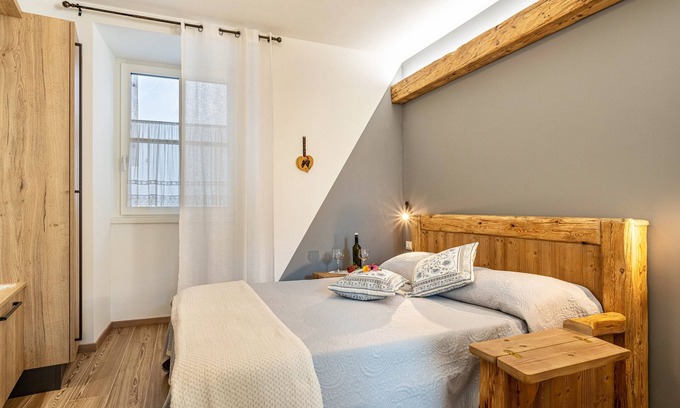 Levico Terme Apartment | Holiday Apartment 'L'Antica Corte Apt Elena' with Mountain View, Terrace & Wi-Fi