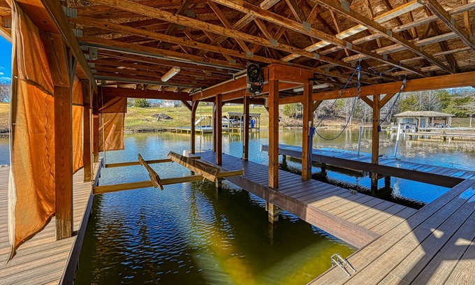 Livingston House | Impressive lakefront home with private dock, 2 boat slips, firepit, deck, grill