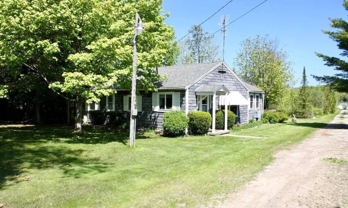Lake Leelanau Cottage | In the narrows on Lake Leelanau, pet friendly, sleeps 8, and a dock!