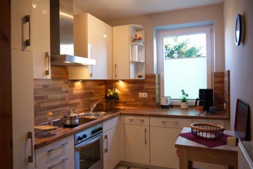 Neue Tiefe House | Inselblume 15 - Ferienwohnung mit Garten, in absoluter Ruhe