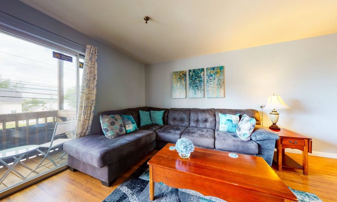 Gilford Condo | Inviting condo in quiet locale with partial lake views, balcony & grilling area
