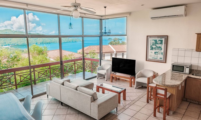 Playa Hermosa Apartment | Inviting ocean-view condo near the beach with pools, scenic balcony, & WiFi