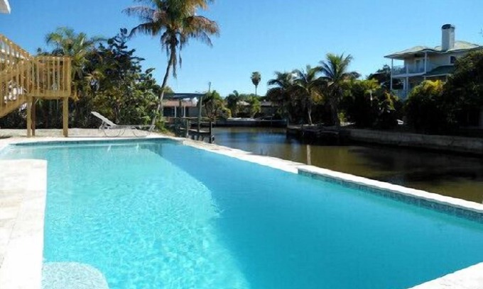 Fort Myers Beach Villa | Island Villa with 33 Foot Infinity Pool, Dock and Boat Access, Dolphin Visits