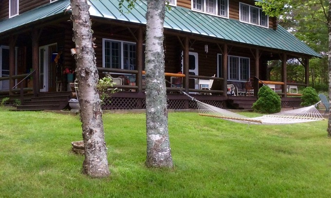 Rangeley House | Justawhim-Private Lakefront Log Lodge with Old World Charm steps from the water.