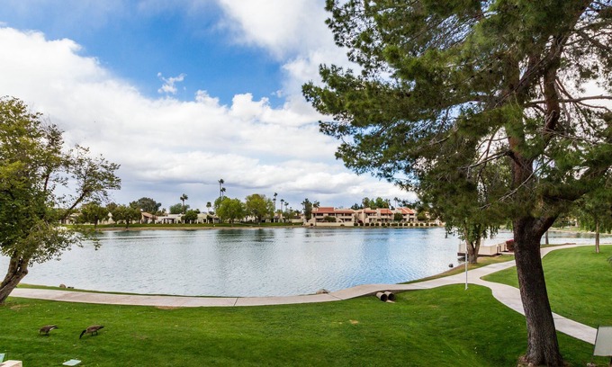 Desert Shores Condo | Lake Front Balcony! Quiet community! Walking path! Restaurants! Heated Pool